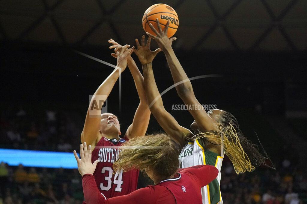 Lm Otero South Dakota center Hannah Sjerven (34) and Baylor center Queen Egbo jump for a rebound during the first half of a college basketball game in the second round of the NCAA tournament in Waco, Texas, Sunday, March 20, 2022. (AP Photo/LM Otero)