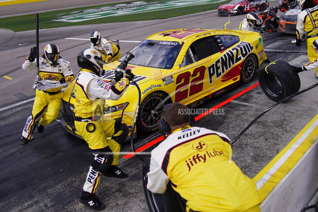 John Locher Joey Logano (22) makes a pit stop during a NASCAR Cup Series auto race Sunday, March 6, 2022, in Las Vegas. (AP Photo/John Locher)