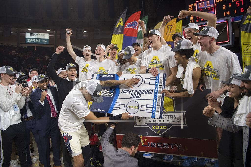 Lee Luther Jr. Liberty basketball team celebrates after defeating Lipscomb in the Atlantic Sun conference NCAA basketball championship game in Lynchburg, Va., Sunday, March 8, 2020. (AP Photo/Lee Luther Jr.)