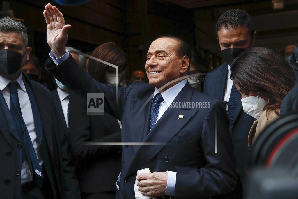 Alessandra Tarantino Former Italian Premier Silvio Berlusconi waves to reporters as he arrives at the Chamber of Deputies to meet Mario Draghi, in Rome, Tuesday, Feb. 9, 2021. Former European Central Bank chief Draghi is consulting Italy's fractious parties after being tapped by President Sergio Mattarella to try to pull together a government to guide the debt-riddled country through the health and economic crises it is confronting. (AP Photo/Alessandra Tarantino)