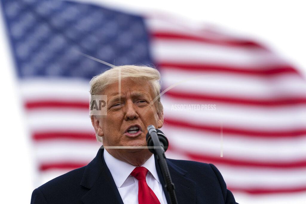 Alex Brandon President Donald Trump speaks near a section of the U.S.-Mexico border wall, Tuesday, Jan. 12, 2021, in Alamo, Texas. (AP Photo/Alex Brandon)