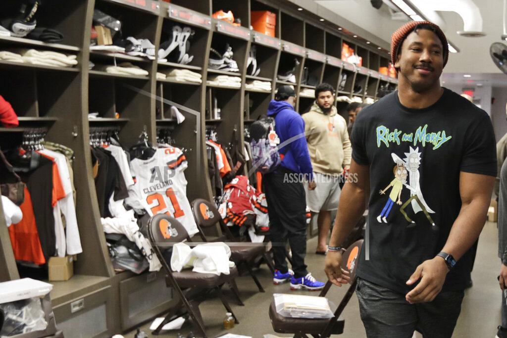 Tony Dejak FILE - In this Dec. 30, 2019, file photo, Cleveland Browns defensive end Myles Garrett walks through the locker room at the NFL football team's training camp facility in Berea, Ohio. The NFL is taking baby steps toward full reopenings for its teams. It has no other choice. Consider social distancing. This could be the most difficult task of all. (AP Photo/Tony Dejak, File)