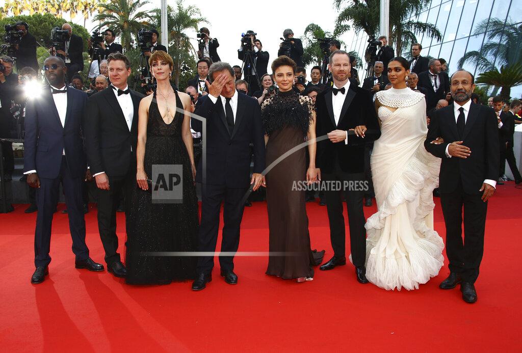 Joel C Ryan Jury President Vincent Lindon, centre, poses with jury members Ladj Ly, from left, Jeff Nichols, Rebecca Hall, Jasmine Trinca, Joachim Trier, Deepika Padukone, and Asghar Farhadi for photographers upon arrival at the awards ceremony of the 75th international film festival, Cannes, southern France, Saturday, May 28, 2022. (Photo by Joel C Ryan/Invision/AP)