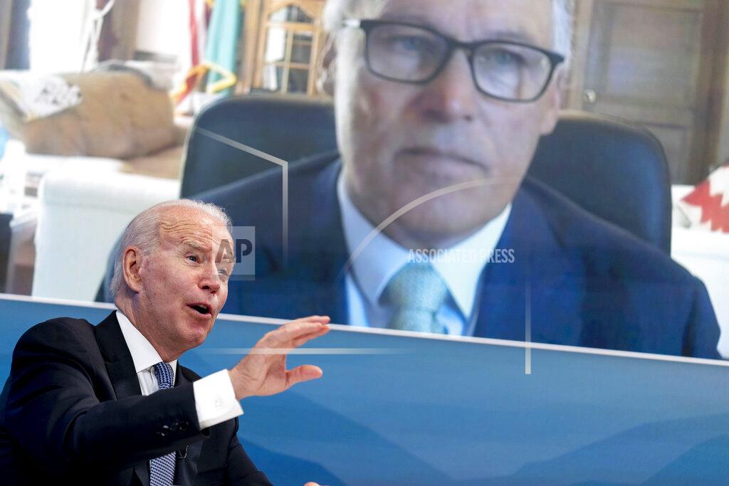 Andrew Harnik President Joe Biden speaks with Washington Gov. Jay Inslee via teleconference during a meeting with governors to discuss ongoing efforts to strengthen wildfire prevention, preparedness and response efforts, and hear firsthand about the ongoing impacts of the 2021 wildfire season in the South Court Auditorium in the Eisenhower Executive Office Building on the White House Campus in Washington, Friday, July 30, 2021. (AP Photo/Andrew Harnik)