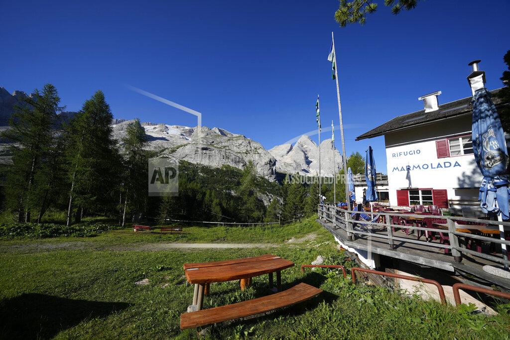 Luca Bruno A view of the Marmolada mountain hut seen in front of the Punta Rocca glacier near Canazei, in the Italian Alps in northern Italy, Wednesday, July 6, 2022, where an avalanche broke loose on Sunday, sending tons of ice, snow, and rocks onto hikers. (AP Photo/Luca Bruno)