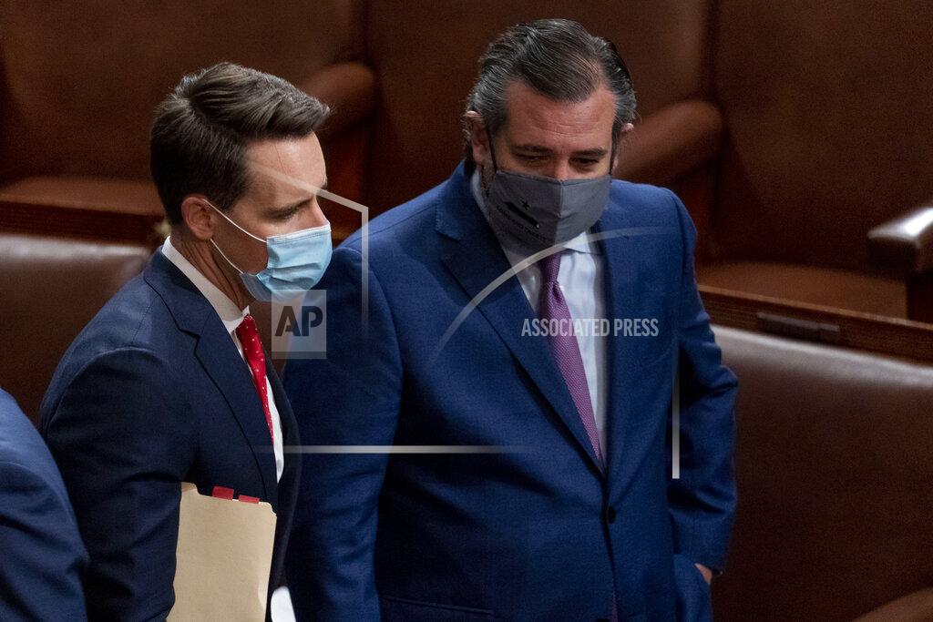Andrew Harnik Sen. Josh Hawley, R-Mo., left, and Sen. Ted Cruz, R-Texas, right, speak after Republicans objected to certifying the Electoral College votes from Arizona, during a joint session of the House and Senate to confirm the electoral votes cast in November's election, at the Capitol, Wednesday, Jan 6, 2021. (AP Photo/Andrew Harnik)