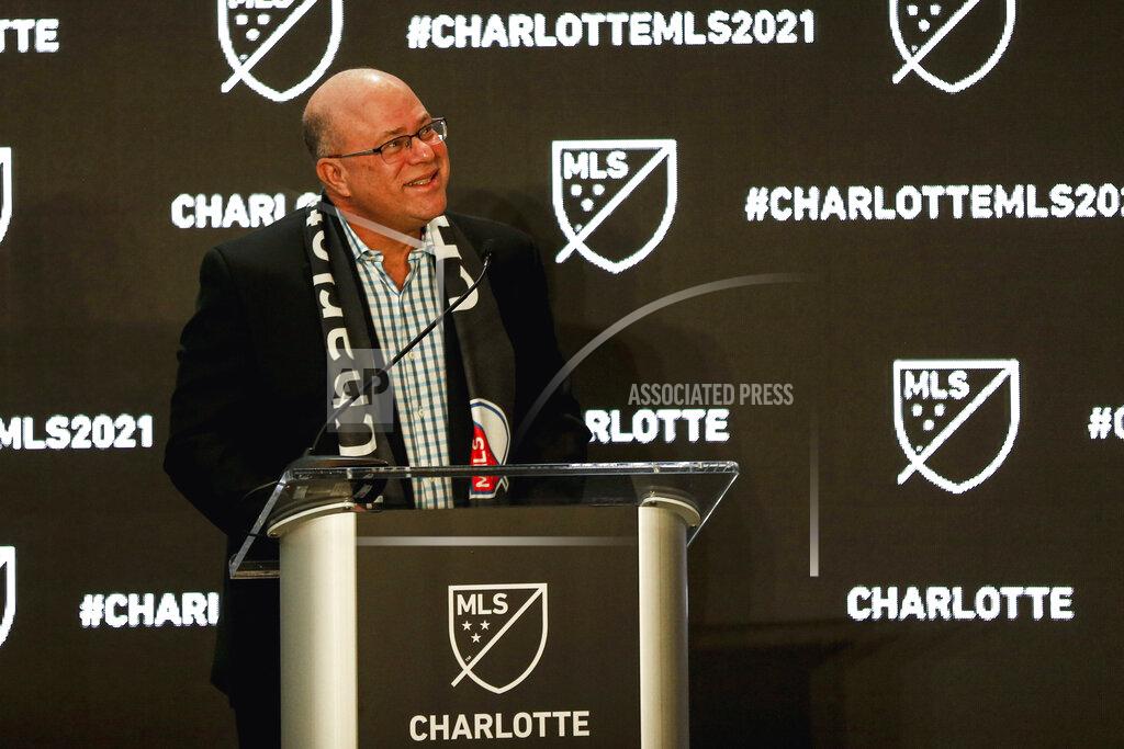 Nr David Tepper looks up at fans as he announces he will bring an MLS soccer team to Charlotte in 2021 at an event in Charlotte, N.C., Tuesday, Dec. 17, 2019. (AP Photo/Nell Redmond