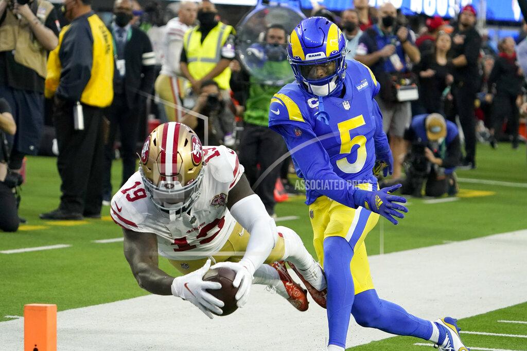 Elaine Thompson San Francisco 49ers wide receiver Deebo Samuel (19) dives into the end zone to score past Los Angeles Rams cornerback Jalen Ramsey (5) during the first half of the NFC Championship NFL football game Sunday, Jan. 30, 2022, in Inglewood, Calif. (AP Photo/Elaine Thompson)
