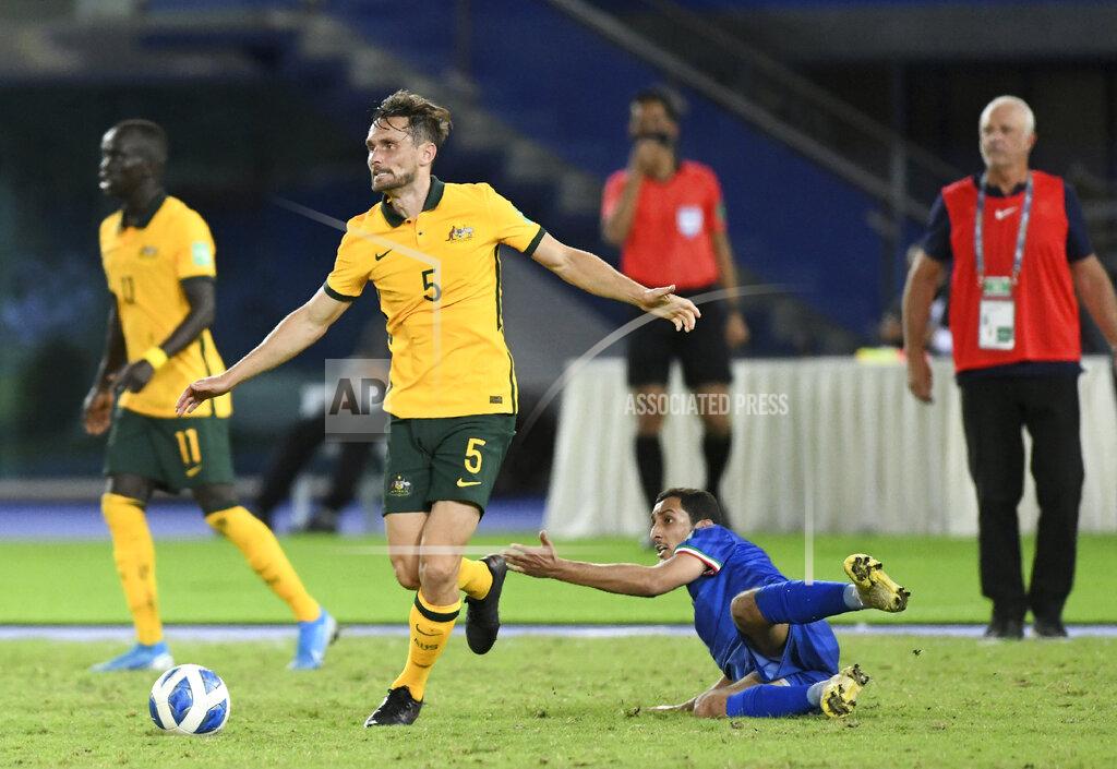 Jaber Abdulkhaleg Australia's James Holland, left, is challenged by Kuwait's Fawaz Alotaibi during the World Cup 2022 Group B qualifying soccer match between Kuwait and Australia in Kuwait City, Kuwait, Thursday, June 3, 2021. (AP Photo/Jaber Abdulkhaleg)