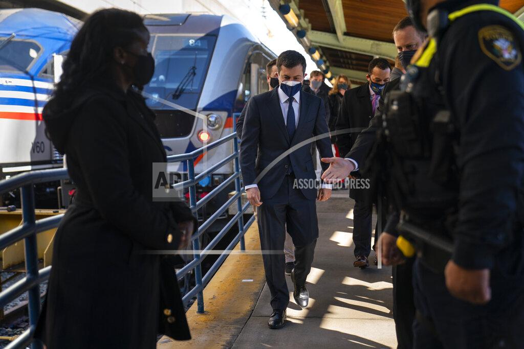Carolyn Kaster Transportation Secretary Pete Buttigieg walks from a train platform after visiting with Amtrak workers at Union Station in Washington, Friday, Feb. 5, 2021. (AP Photo/Carolyn Kaster)