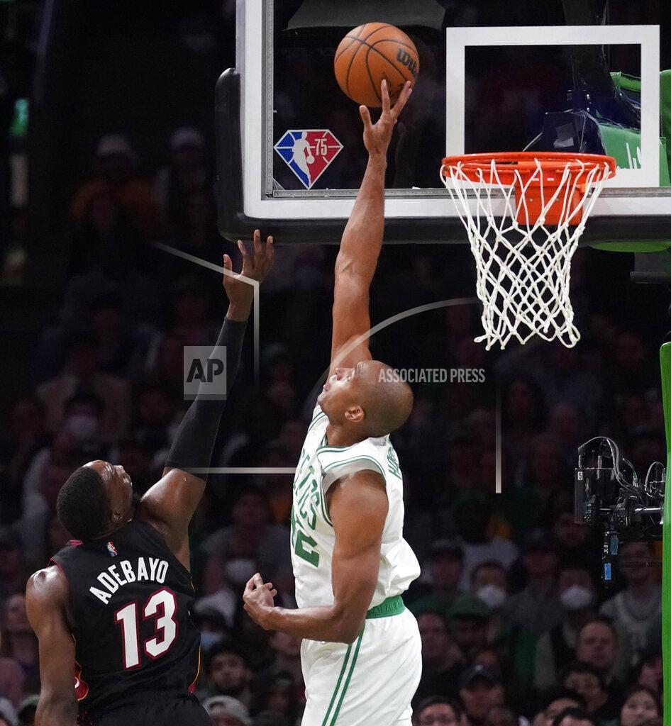 Charles Krupa Boston Celtics center Al Horford, right, blocks a shot by Miami Heat center Bam Adebayo (13) during the second half of Game 4 of the NBA basketball playoffs Eastern Conference finals, Monday, May 23, 2022, in Boston. (AP Photo/Charles Krupa)