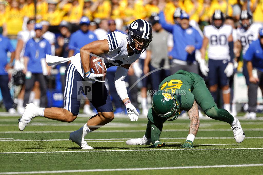 Ron Jenkins BYU wide receiver Neil Pau'u (2) takes a pass for a first down as he gets by Baylor linebacker Matt Jones (52) during the first half of an NCAA college football game Saturday, Oct. 16, 2021, in Waco, Texas. (AP Photo/Ron Jenkins)