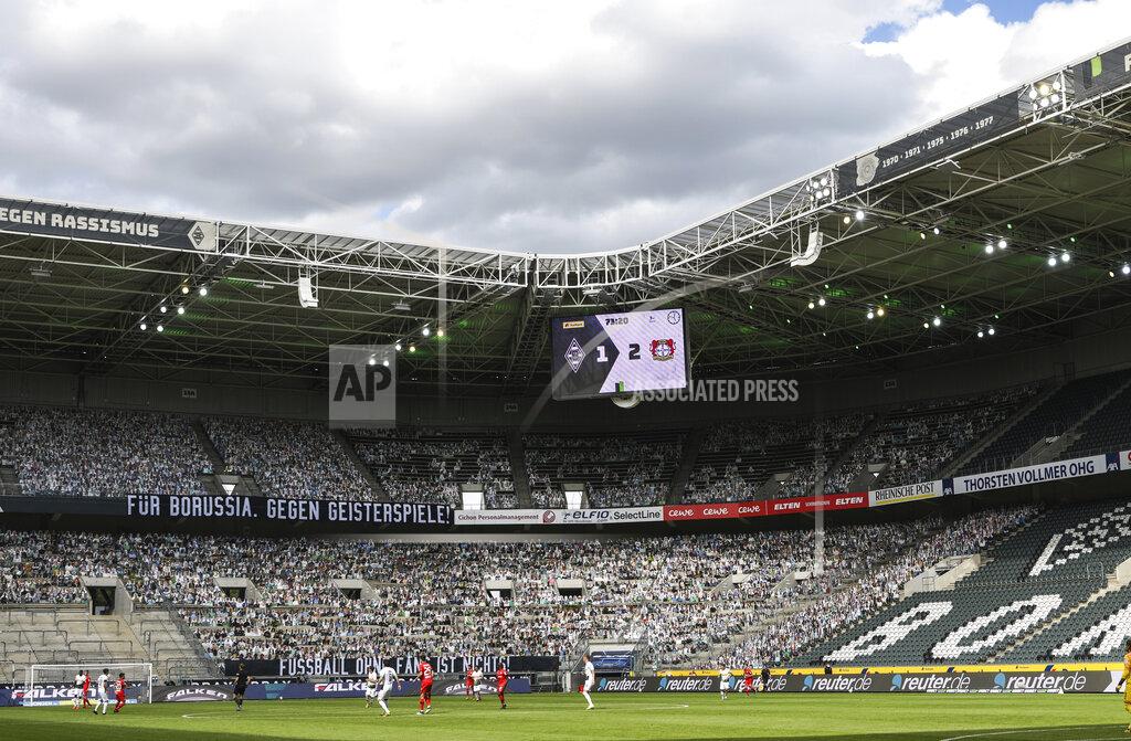 Ina Fassbender A banner reading "For Borussia, against ghost matches" is displayed during the German Bundesliga soccer match between Borussia Moenchengladbach and Leverkusen, in Moenchengladbach, Germany, Saturday, May 23, 2020. (Ina Fassbender Pool Photo via AP)
