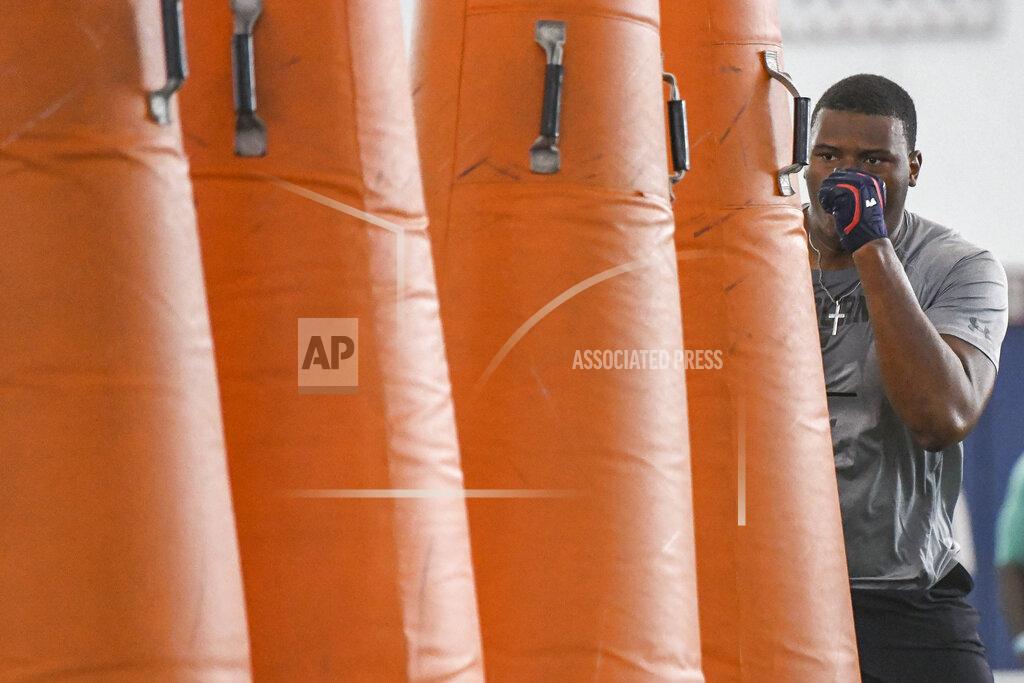 Julie Bennett Defensive tackle Derrick Brown prepares for a drill during Auburn NCAA college football Pro Day, Friday, March 6, 2020, in Auburn, Ala. (AP Photo/Julie Bennett)