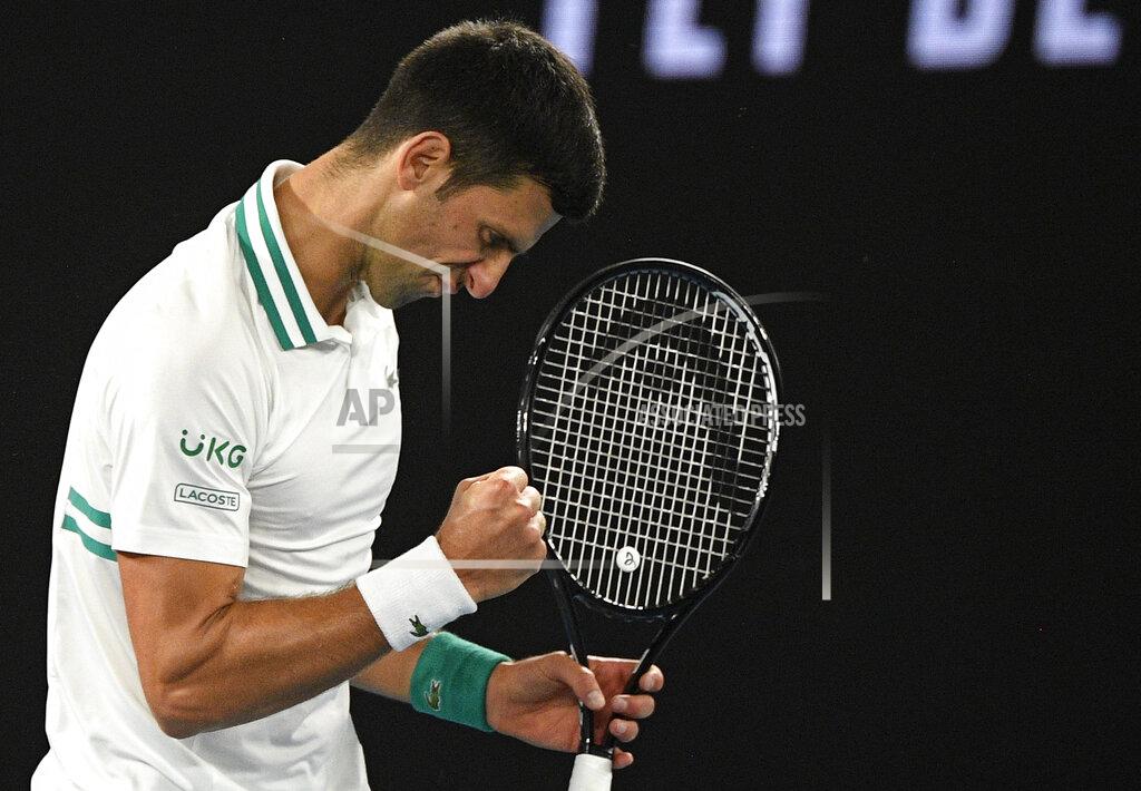 Andy Brownbill Serbia's Novak Djokovic reacts after winning a point against Russia's Daniil Medvedev during the men's singles final at the Australian Open tennis championship in Melbourne, Australia, Sunday, Feb. 21, 2021.(AP Photo/Andy Brownbill)