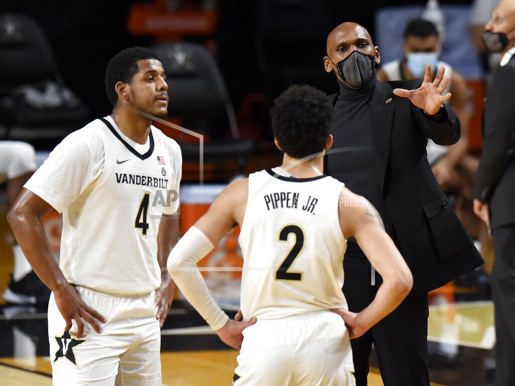 Mark Zaleski Vanderbilt head coach Jerry Stackhouse talks with guard's Jordan Wright (4) and Scotty Pippen Jr. (2) during the second half of an NCAA college basketball game against Arkansas, Saturday, Jan. 23, 2021, in Nashville, Tenn. Arkansas won 92-71. (AP Photo/Mark Zaleski)