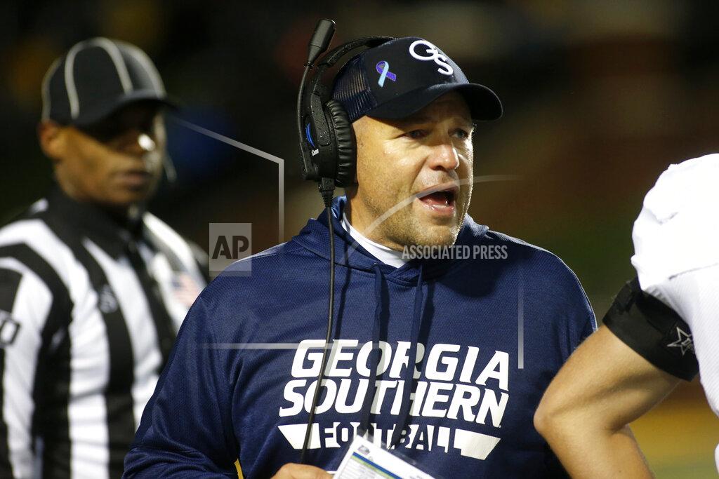 Brian Blanco Georgia Southern coach Chad Lunsford speaks to his players during a break in the action during the first half of an NCAA college football game against Appalachian State on Thursday, Oct. 31, 2019, in Boone, N.C. (AP Photo/Brian Blanco)