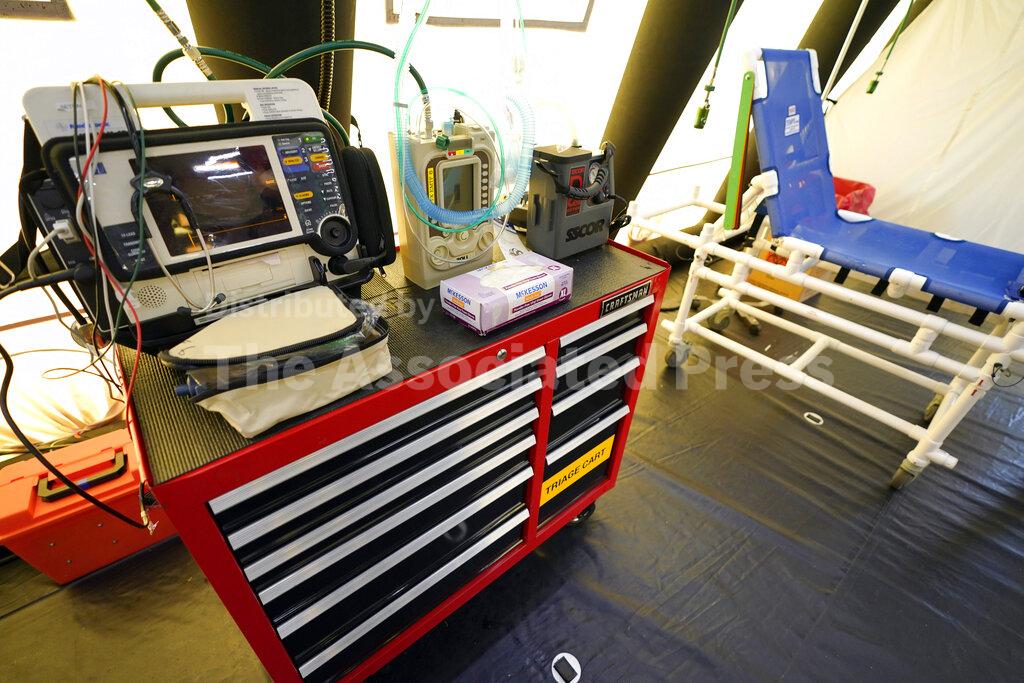 A triage cart is shown inside the intensive care unit during a tour of the new Harris County Non-Congregate Medical Shelter at NRG Park Saturday, April 11, 2020, in Houston. The new temporary setup will have 250 beds initially with a capacity of 2000 beds, if needed, to help relieve pressure on the hospital system from COVID-19 patients. Activation is not intended at this time. (AP Photo/David J. Phillip)