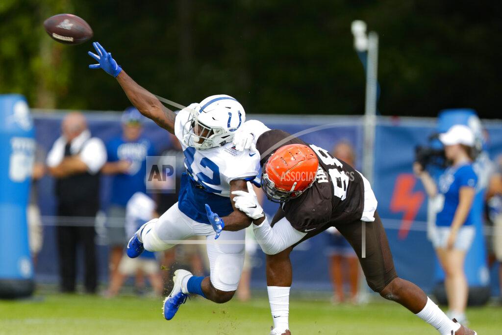 Michael Conroy Indianapolis Colts defensive back Rolan Milligan (42) breaks up a pass toe Cleveland Browns tight end Demetrius Harris (88) during practice at the NFL team's football training camp in Westfield, Ind., Thursday, Aug. 15, 2019. (AP Photo/Michael Conroy)