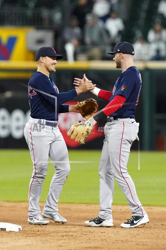 Charles Rex Arbogast Boston Red Sox's Enrique Hernandez, left, and Trevor Story celebrate the team's 16-3 win over the Chicago White Sox in a baseball game Tuesday, May 24, 2022, in Chicago. (AP Photo/Charles Rex Arbogast)