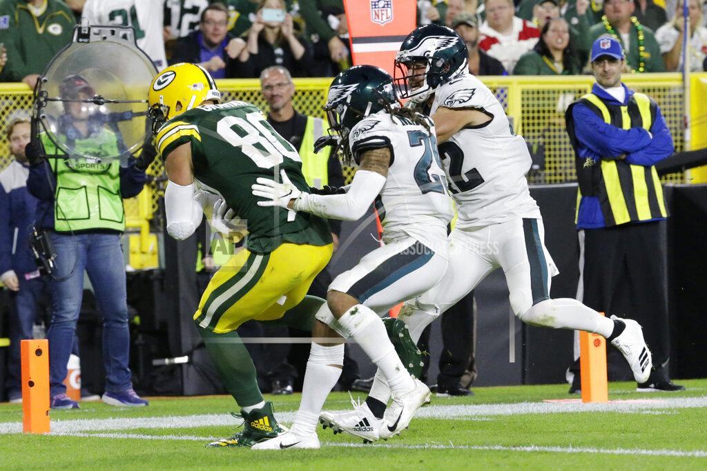 Mike Roemer Green Bay Packers tight end Jimmy Graham (80) pulls in a catch for a touchdown while being defended by Philadelphia Eagles cornerback Avonte Maddox (29) and strong safety Andrew Sendejo (42) during the second half of an NFL football game Thursday, Sept. 26, 2019, in Green Bay, Wis. (AP Photo/Mike Roemer)