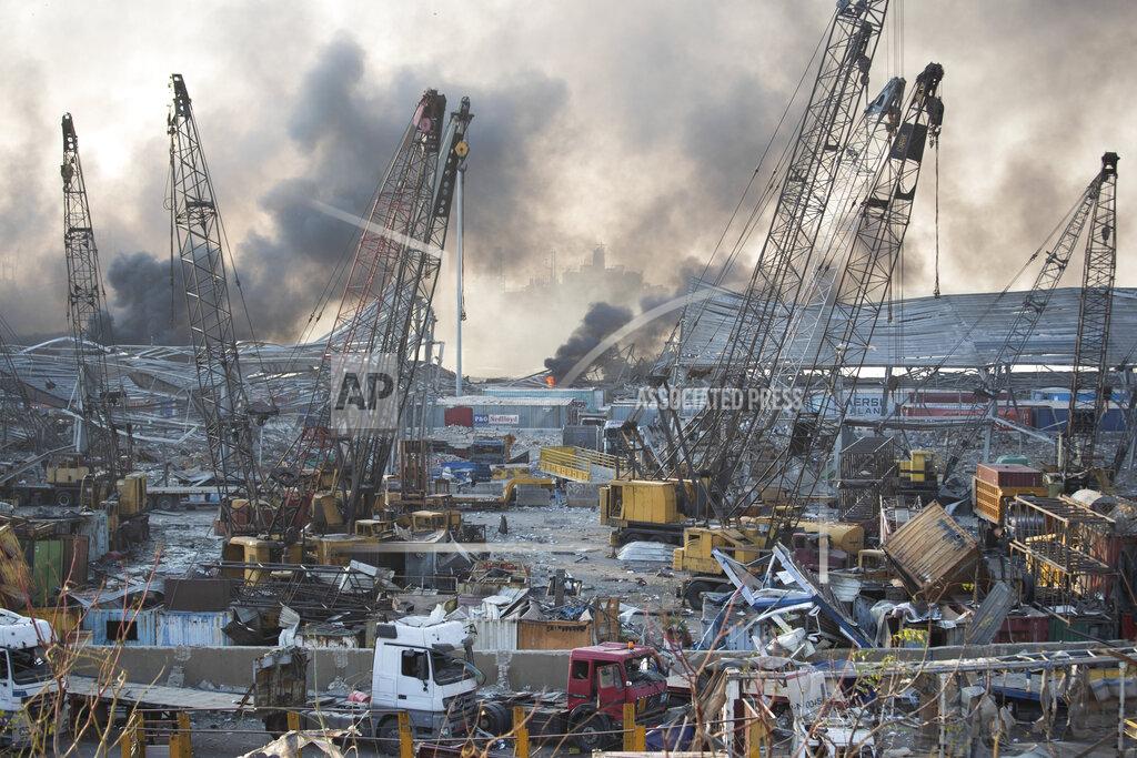 Hassan Ammar Aftermath of a massive explosion is seen in in Beirut, Lebanon, Tuesday, Aug. 4, 2020. Massive explosions rocked downtown Beirut on Tuesday, flattening much of the port, damaging buildings and blowing out windows and doors as a giant mushroom cloud rose above the capital. Witnesses saw many people injured by flying glass and debris. (AP Photo/Hassan Ammar)