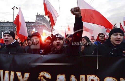 FILE - In this Monday, Nov. 11, 2019 file photo, people take part in the March of Independence organized by far right activists to celebrate 101 years of Poland's independence in Warsaw, Poland. A Polish court has upheld an attempt by the Warsaw mayor to ban a yearly march organized by nationalists on Poland’s Independence Day. But organizers vowed Wednesday, Oct. 27, 2021 to appeal and insisted they would march as planned. (AP Photo/Czarek Sokolowski, File)