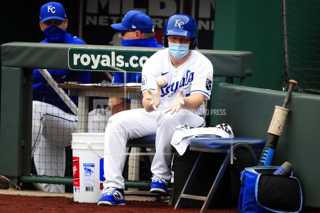 Orlin Wagner A ballboy catches a ball being taken out of play during the third inning of an exhibition baseball game between the Kansas City Royals and the Houston Astros at Kauffman Stadium in Kansas City, Mo., Tuesday, July 21, 2020. (AP Photo/Orlin Wagner)