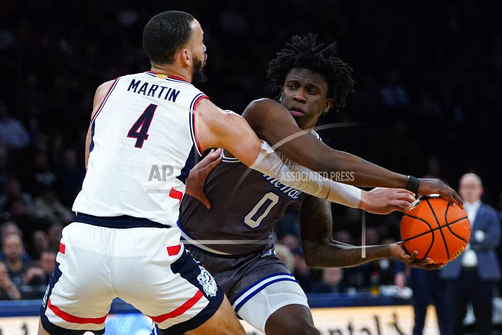 Frank Franklin Ii Seton Hall's Kadary Richmond (0) protects the ball from Connecticut's Tyrese Martin (4) during the second half of an NCAA college basketball game at the Big East men's tournament Thursday, March 10, 2022, in New York. Connecticut won 62-52. (AP Photo/Frank Franklin II)