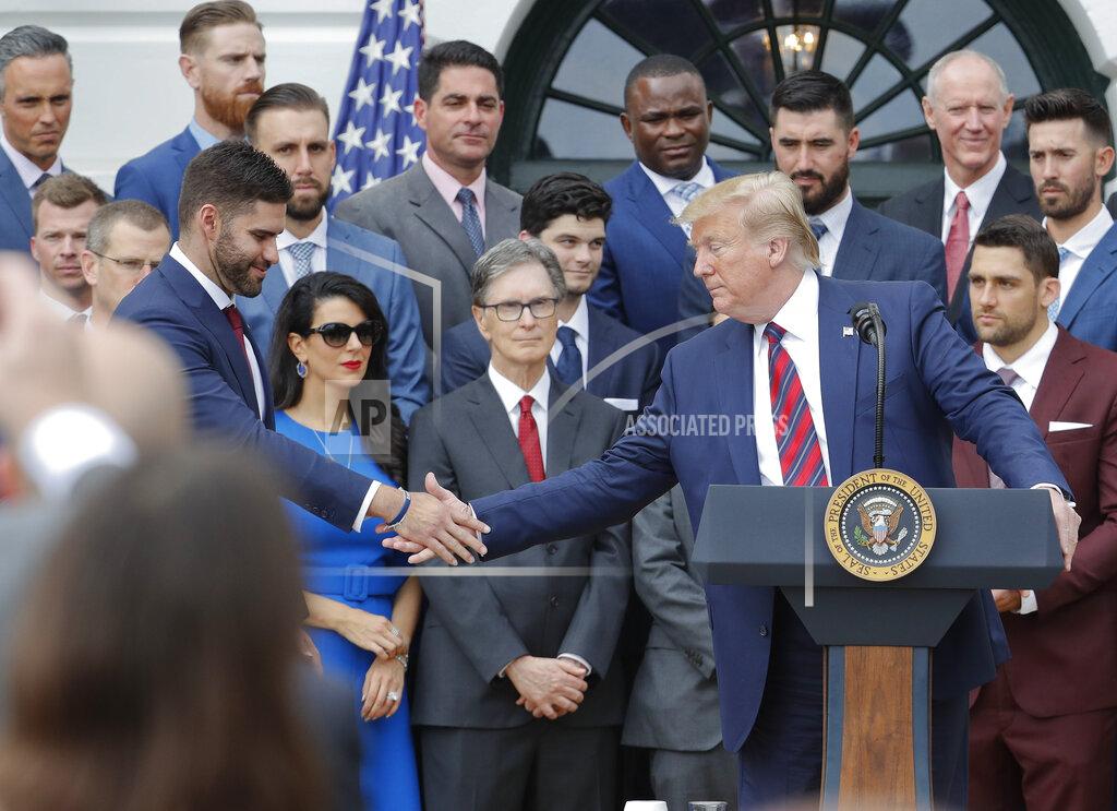 Pablo Martinez Monsivais President Donald Trump, right, reaches over to shake hands with outfielder J.D. Martinez, left, while speaking during a ceremony on the South Lawn of the White House in Washington, Thursday, May 9, 2019, where he honored the 2018 World Series Baseball Champion Boston Red Sox. (AP Photo/Pablo Martinez Monsivais)