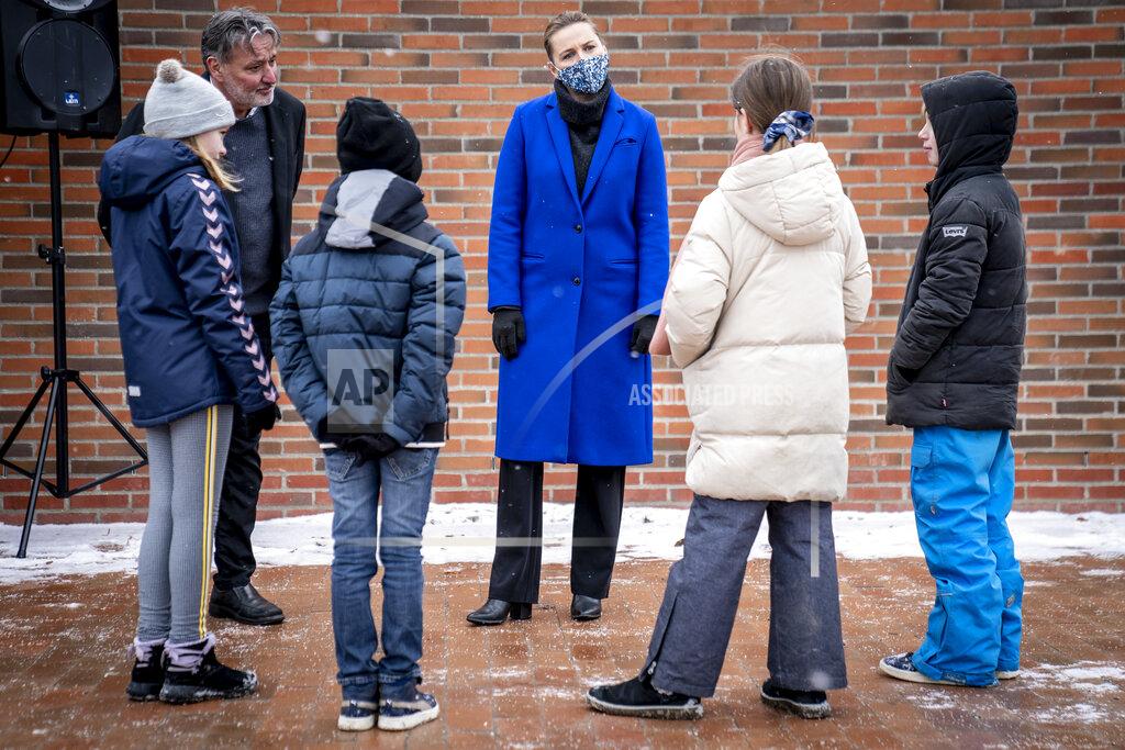 Mads Claus Rasmussen Pupils at Allerslev Skole speak to Denmark'sPrime Minister Mette Frederiksen, centre, on their first day back at school, in Lejre, on the island of Sealand, Denmark, Monday, Feb. 8, 2021. Students in the lower grades returned to the classrooms after schools were closed in an effort to control the spread of coronavirus. Denmark's Prime Minister Mette Frederiksen said Monday it was uncertain when older students would return to school. (Mads Claus Rasmussen/Ritzaus Scanpix via AP)