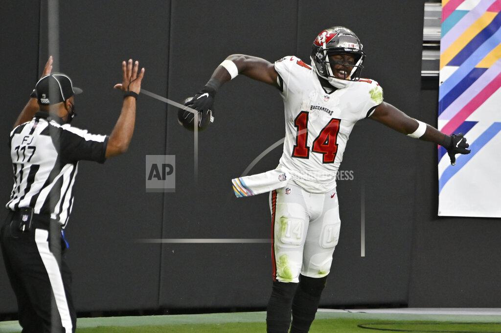 David Becker Tampa Bay Buccaneers wide receiver Chris Godwin (14) celebrates after scoring a touchdown against the Las Vegas Raiders during the second half of an NFL football game, Sunday, Oct. 25, 2020, in Las Vegas. (AP Photo/David Becker)