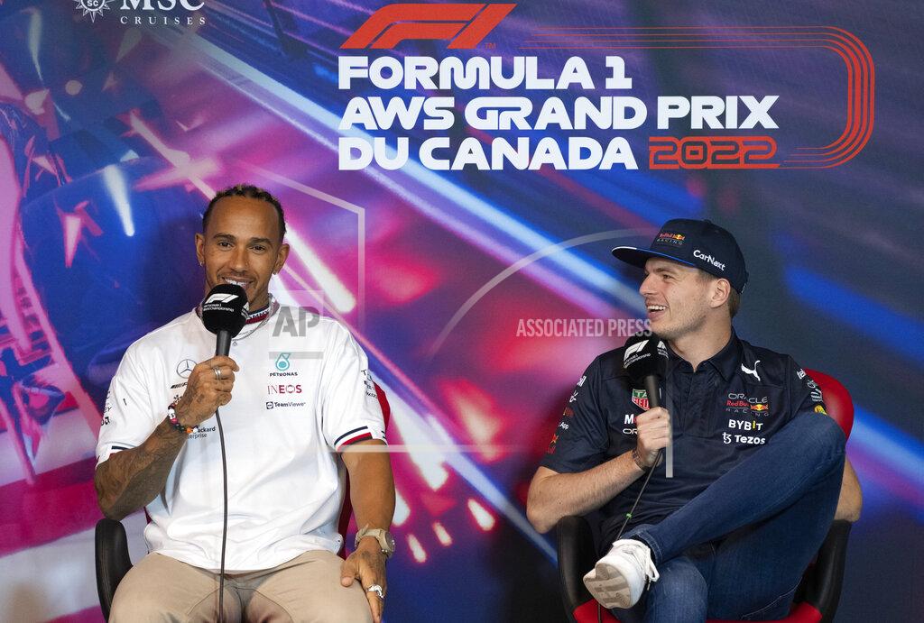 Paul Chiasson Mercedes Team driver Lewis Hamilton, left, of Great Britain, and Red Bull Racing driver Max Verstappen, of the Netherlands, share a laugh during a news conference at the Canadian Grand Prix auto race, Friday, June 17, 2022, in Montreal. (Paul Chiasson/The Canadian Press via AP)