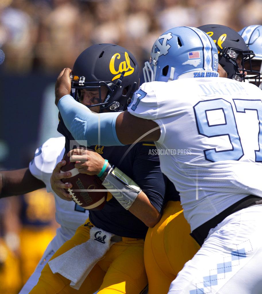 D. Ross Cameron California quarterback Ross Bowers, left, is sacked for a loss by North Carolina defensive lineman Jalen Dalton (97) during the first half of an NCAA college football game, Saturday, Sept. 1, 2018, in Berkeley, Calif. (AP Photo/D. Ross Cameron)