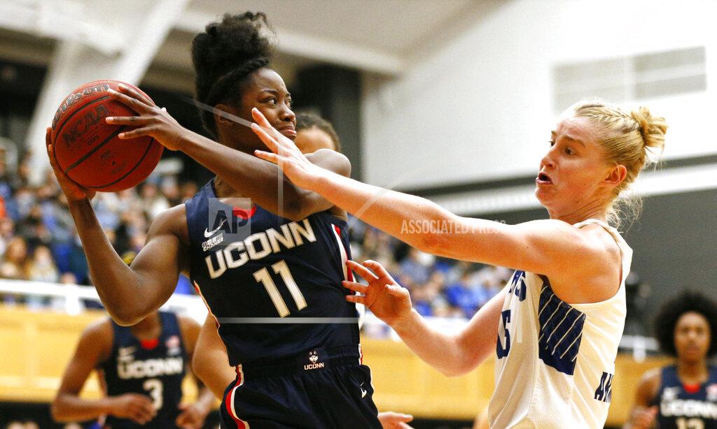 Noah K. Murray Seton Hall guard Katie Armstrong, right, defends against Connecticut forward Mir McLean (11) during the second half of an NCAA college basketball game on Friday, Dec. 3, 2021, in South Orange, N.J. (AP Photo/Noah K. Murray)