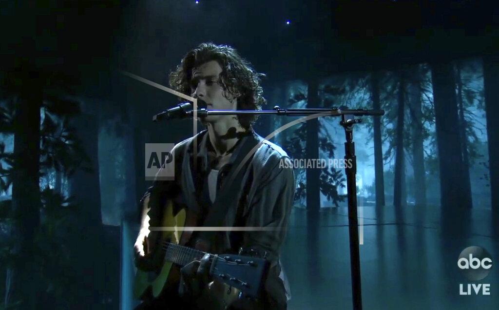 Uncredited In this screen shot provided by ABC on Sunday, Nov. 22, 2020, Shawn Mendes performs at the American Music Awards at the Microsoft Theater in Los Angeles. (ABC via AP)