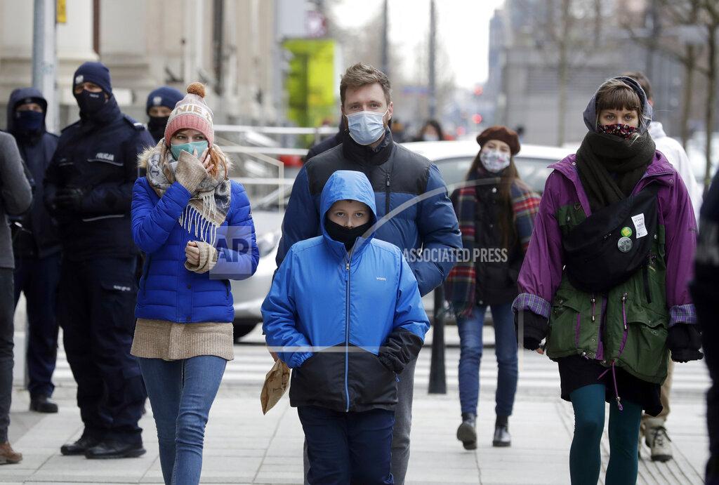 Czarek Sokolowski FILE - In this Saturday, March 20, 2021 file photo, few people walk on the streets after Poland reintroduced a partial nationwide lockdown on Saturday to curb a sudden spike in new COVID-19 cases, in Warsaw, Poland. Many regions in Central Europe and the Balkans are facing one of the most difficult moments since the coronavirus pandemic struck over a year ago. Poland recorded its highest daily number of new coronavirus infections Wednesday March 24, 2021, as hospitals buckled under a new surge. (AP Photo/Czarek Sokolowski, File)