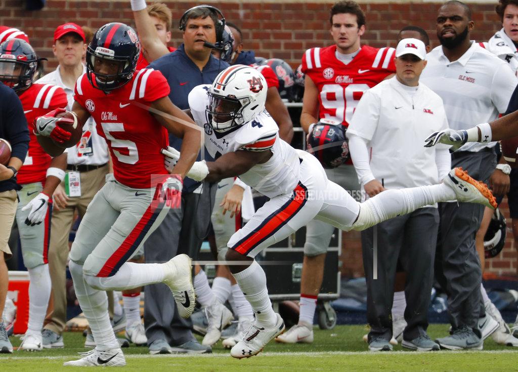 Rogelio V. Solis Mississippi wide receiver DaMarkus Lodge (5) pulls away with a first down pass reception from Auburn defensive back Noah Igbinoghene during the first half of an NCAA college football game against on Saturday, Oct. 20, 2018, in Oxford, Miss. Auburn won 31-16. (AP Photo/Rogelio V. Solis)