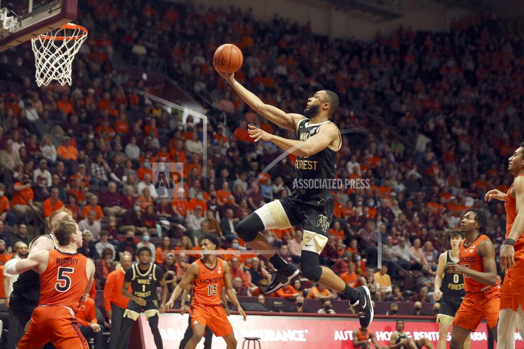 Matt Gentry Dallas Walton (13) of Wake Forest scores in the first half of an NCAA college basketball game against Virginia Tech in Blacksburg, Va. Saturday, Dec. 4 2021. (Matt Gentry/The Roanoke Times via AP)