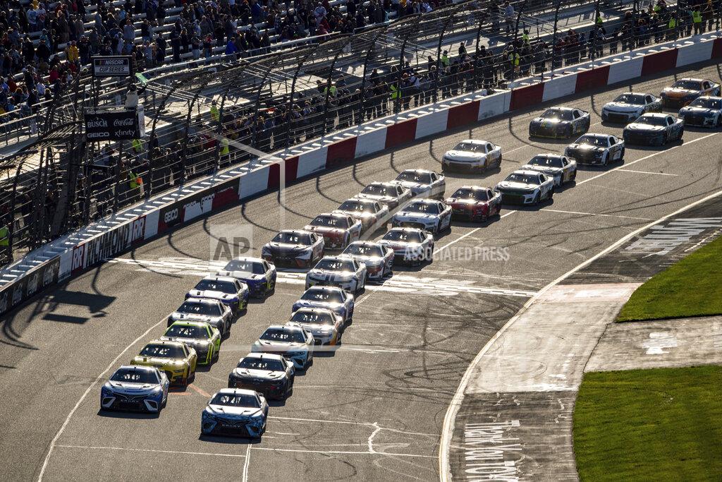 Mike Caudill Drivers line up for a restart during the NASCAR Cup Series auto race at Richmond Raceway on Sunday, April 3, 2022, in Richmond, Va. (AP Photo/Mike Caudill)