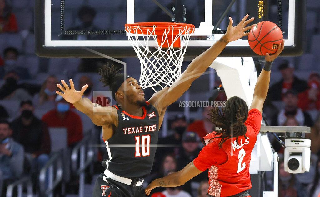 Ron Jenkins Texas Tech forward Tyreek Smith (10) blocks the shot of Houston guard Caleb Mills (2) during the first half of an NCAA college basketball game, Sunday, Nov. 29, 2020, in Fort Worth, Texas. (AP Photo/Ron Jenkins)
