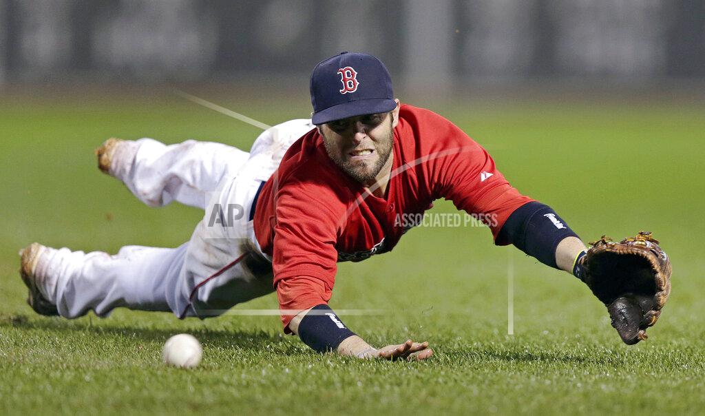 Charles Krupa FILE - In this June 13, 2014, file photo, Boston Red Sox second baseman Dustin Pedroia dives to make the play on a ground out by Cleveland Indians' Lonnie Chisenhall during the sixth inning of a baseball game at Fenway Park in Boston. Pedroia, who was the 2007 Rookie of the Year and the AL MVP in his second season, retired Monday, Feb. 1, 2021. (AP Photo/Charles Krupa, File)