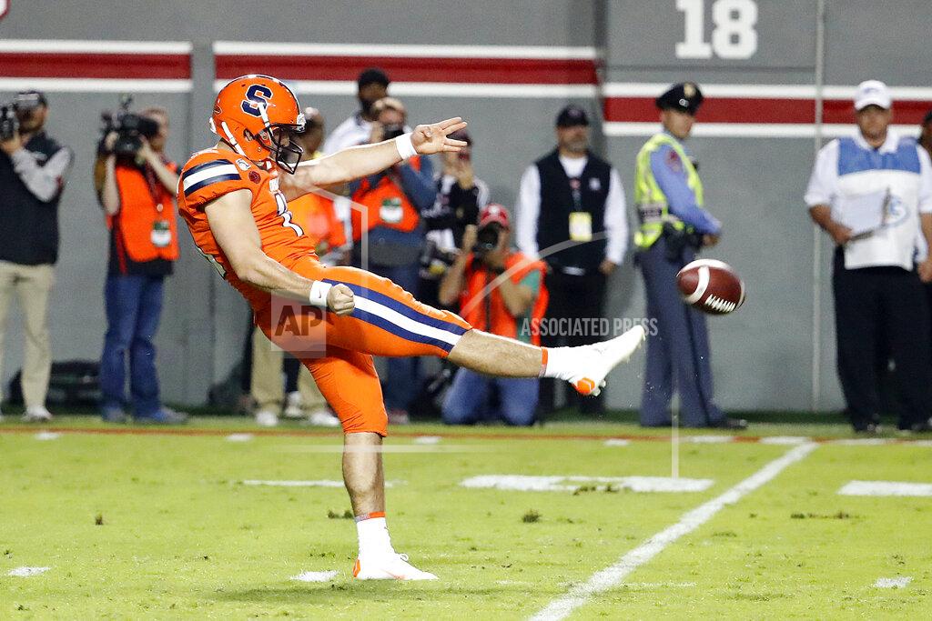 Karl B Deblaker File- This Oct. 10, 2019, file photo shows Syracuse's Sterling Hofrichter (10) punting the ball against the North Carolina State during the first half of an NCAA college football game in Raleigh, N.C. Syracuse has a terrific 1-2 punch in Hofrichter and place-kicker Andre Szmyt. Together they’ve helped the Orange excel on special teams for a second straight season. Hofrichter has landed 93 of his 255 career punts inside the 20-yard line with only 13 touchbacks. (AP Photo/Karl B DeBlaker, File)