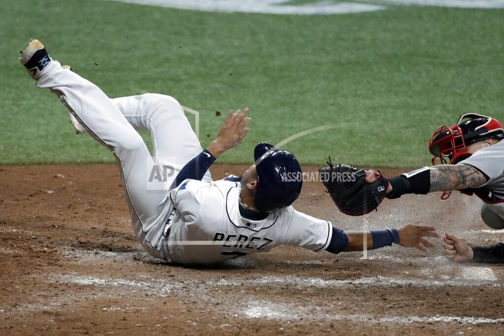 Chris O'meara Tampa Bay Rays' Michael Perez, left, scores ahead of the tag by Boston Red Sox catcher Christian Vazquez on an RBI triple by Austin Meadows during the fifth inning of a baseball game Tuesday, Aug. 4, 2020, in St. Petersburg, Fla. (AP Photo/Chris O'Meara)