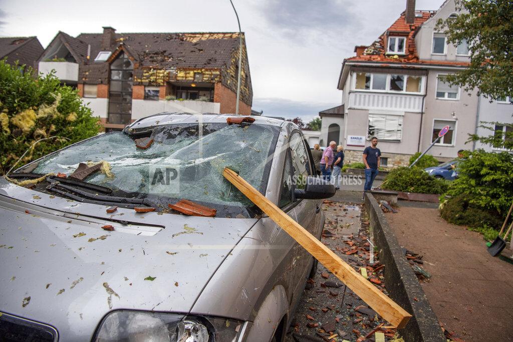 Lino Mirgeler A damaged car is seen after a storm in Paderborn, Germany, Friday, May 20, 2022. (Lino Mirgeler/dpa via AP)
