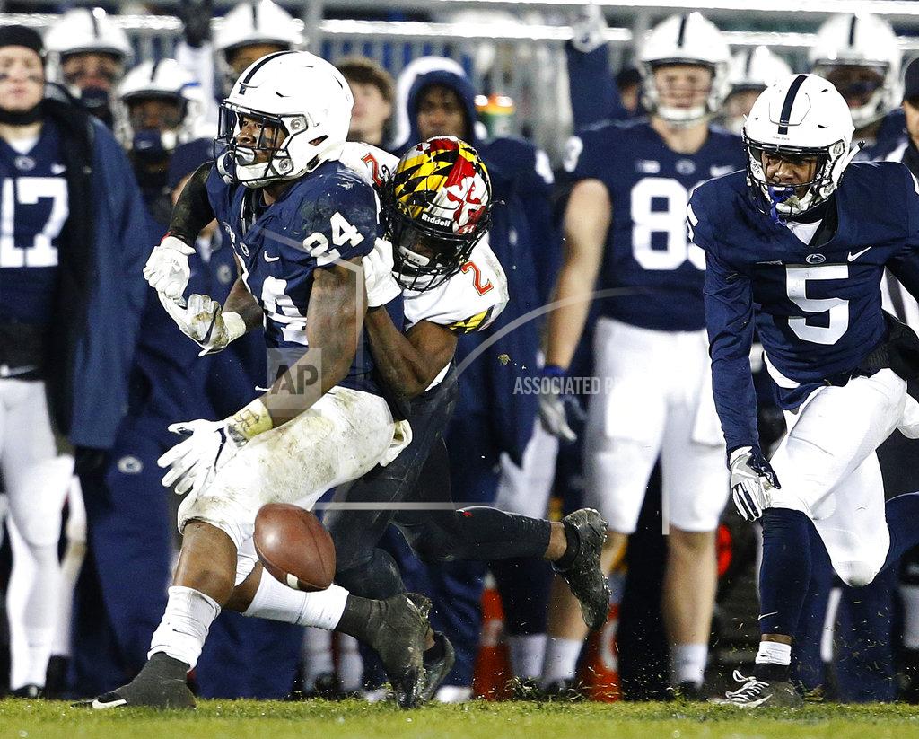 Chris Knight Maryland's RaVon Davis (2) strips the ball from Penn State's Miles Sanders (24) during the second half of an NCAA college football game in State College, Pa., Saturday, Nov. 24, 2018. Penn State won 38-3. (AP Photo/Chris Knight)