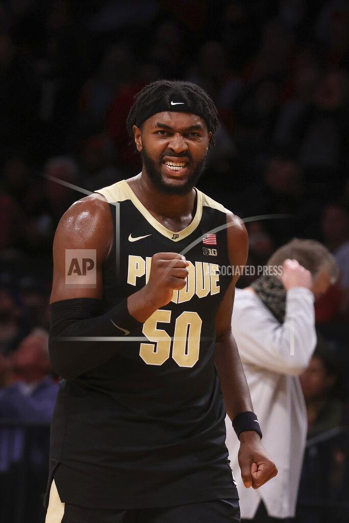 Jason Decrow CORRECTS TO OVERTIME, NOT SECOND HALF - Purdue's Trevion Williams (50) reacts scoring against North Carolina State late in the overtime period of their NCAA college basketball game Sunday, Dec. 12, 2021, in New York. (AP Photo/Jason DeCrow)
