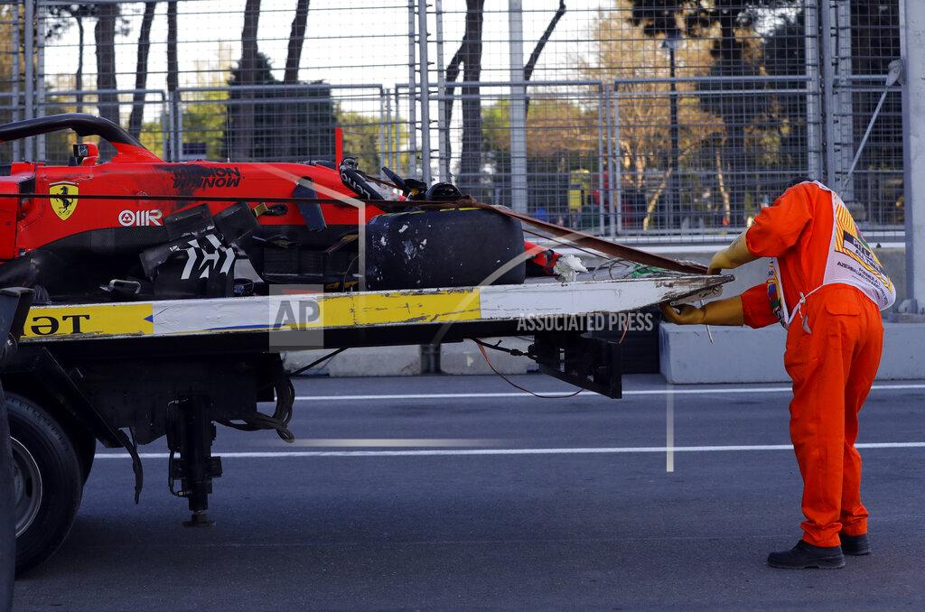 Sergei Grits The car of Ferrari driver Charles Leclerc of Monaco is towed after he crashed during qualifying session at the Baku Formula One city circuit in Baku, Azerbaijan, Saturday, April 27, 2019. The Azerbaijan F1 Grand Prix race will be held on Sunday. (AP Photo/Sergei Grits)