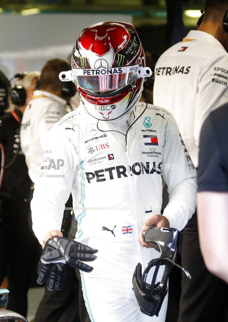 Mercedes driver Lewis Hamilton of Britain prepares to get in his car at the pits during the first free practice at the Monza racetrack, in Monza, Italy, Friday, Sept. 6, 2019. The Formula one race will be held on Sunday. (AP Photo/Antonio Calanni)