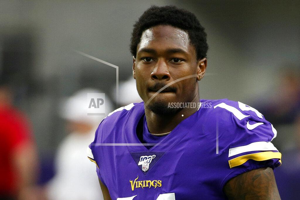 Bruce Kluckhohn FILE - In this Sept. 22, 2019, file photo, Minnesota Vikings wide receiver Stefon Diggs walks on the field before an NFL football game against the Oakland Raiders in Minneapolis. Diggs is expected to address reporters Wednesday, Aug. 5, 2020, during the team's first full week of the Buffalo Bills' training camp, and for the first time since being acquired in a trade with the Vikings in March .(AP Photo/Bruce Kluckhohn, File)